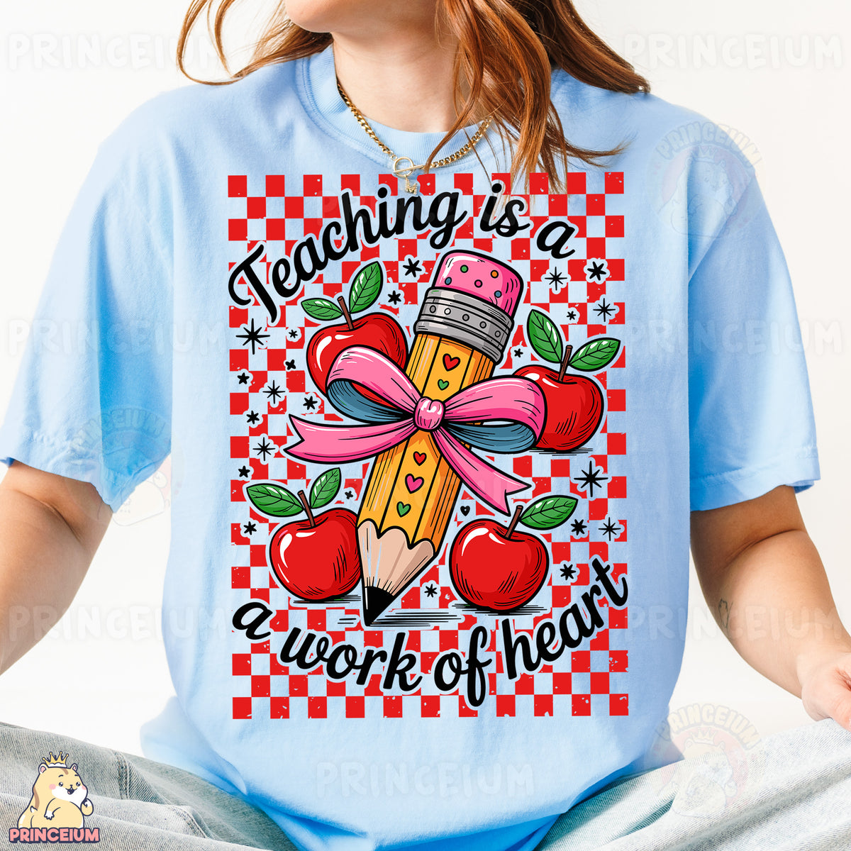 a girl wearing a t - shirt that says teaching is a work of heart