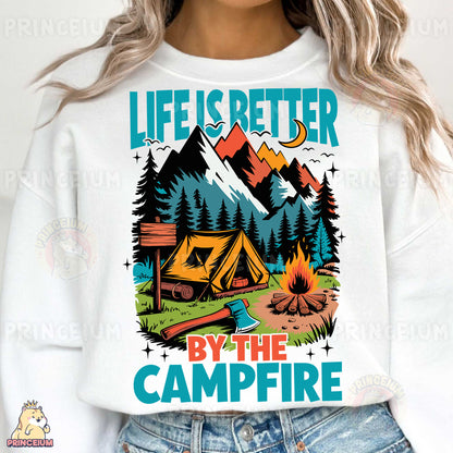 a woman wearing a sweatshirt that says life is better by the campfire