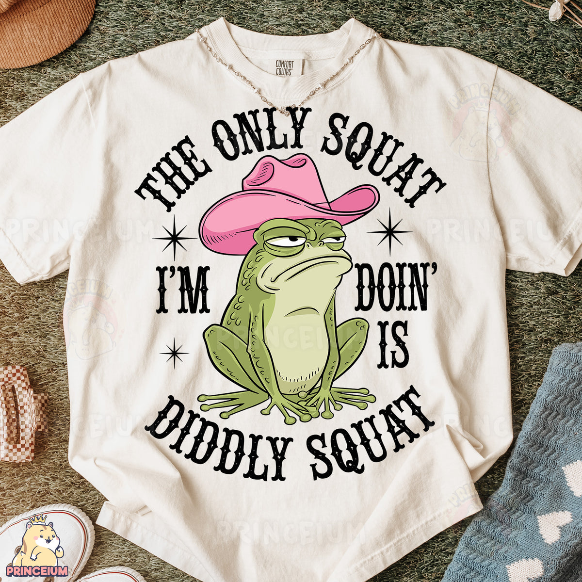 a t - shirt with a frog wearing a pink cowboy hat