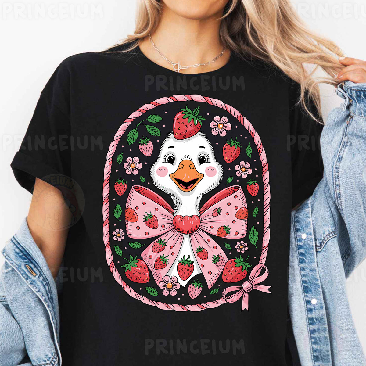 a woman wearing a black t - shirt with a penguin wearing a bow and straw