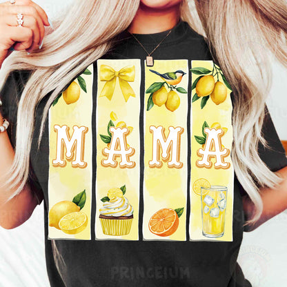 a woman holding up a t - shirt with lemons and cupcakes on