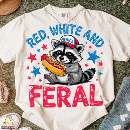 a white shirt with a raccoon eating a hot dog