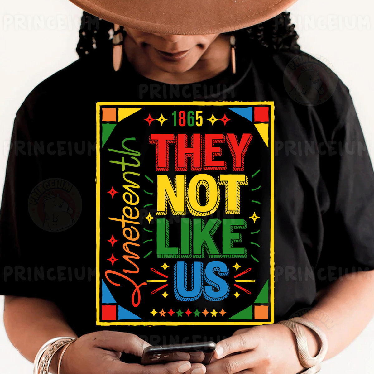 a person wearing a black shirt and a hat holding a cell phone
