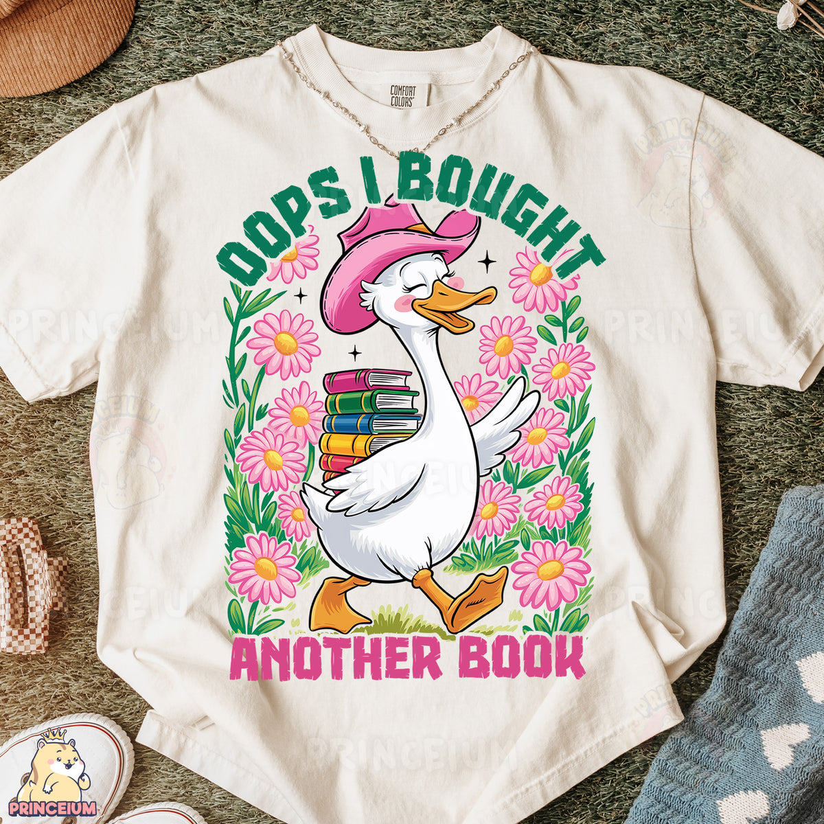 a white shirt with a duck wearing a pink hat