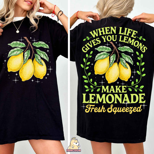 a woman wearing a t - shirt that says when life gives you lemons make