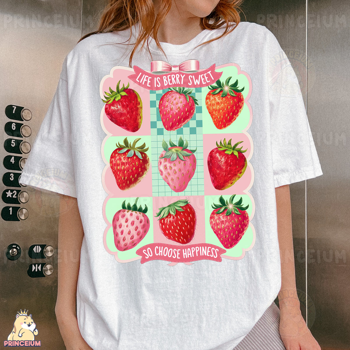 a woman wearing a t - shirt with a picture of strawberries on it