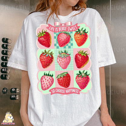 a woman wearing a t - shirt with a picture of strawberries on it