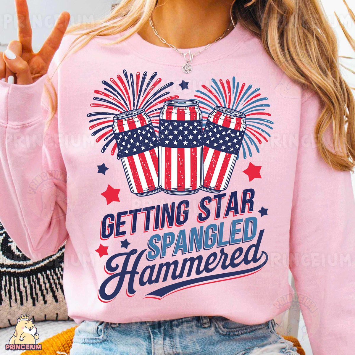 a woman wearing a pink shirt that says getting star spangled hammered