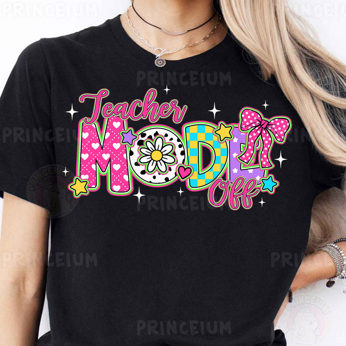 a woman wearing a black teacher mom shirt