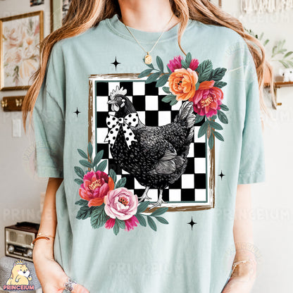 a woman wearing a t - shirt with a chicken on it