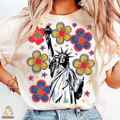 a woman wearing a t - shirt with the statue of liberty on it