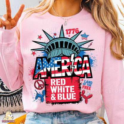 a woman wearing a pink sweatshirt with the statue of liberty on it