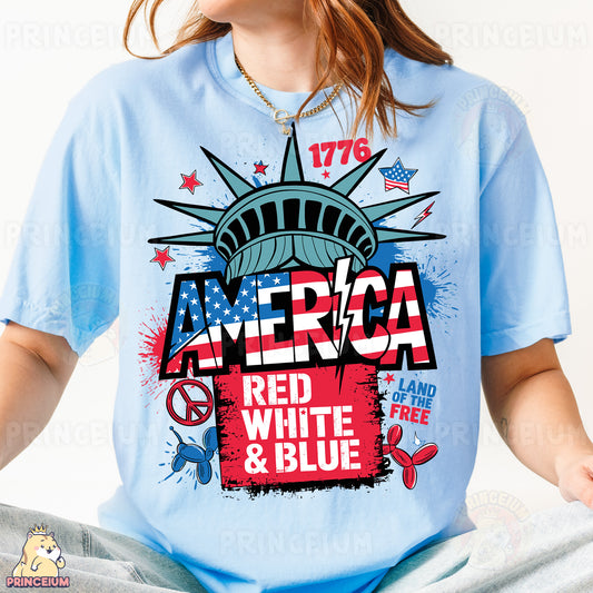 a woman wearing a blue t - shirt with the statue of liberty on it
