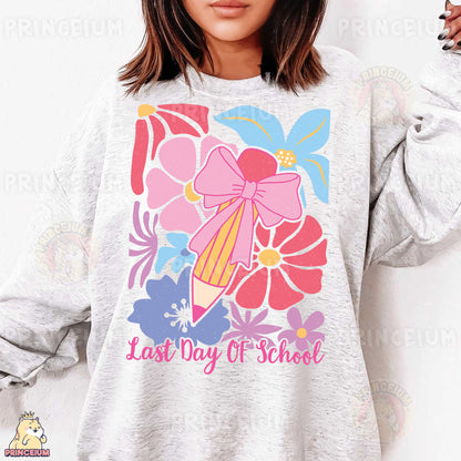a woman wearing a sweatshirt that says last day of school