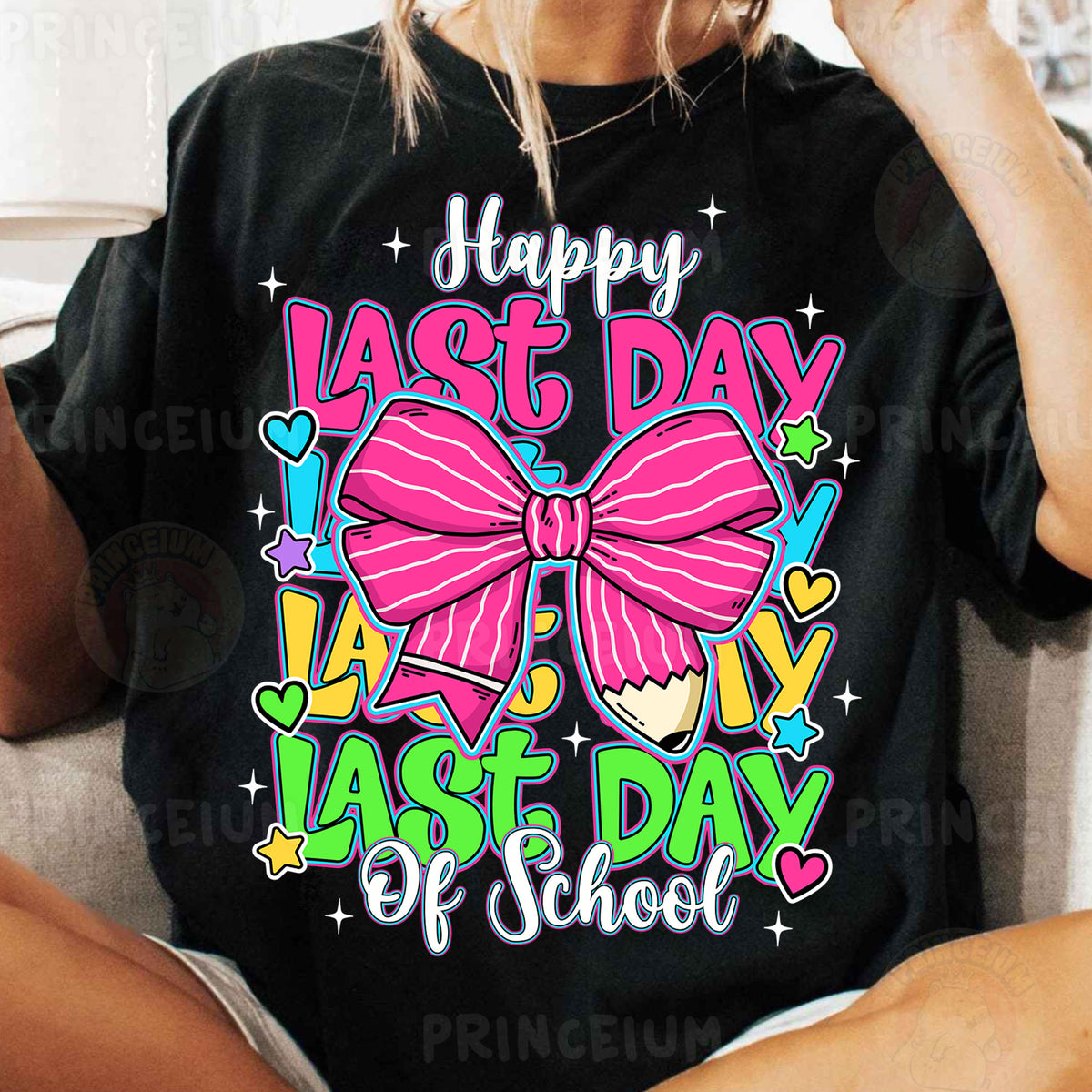 a woman sitting on a couch wearing a happy last day of school shirt