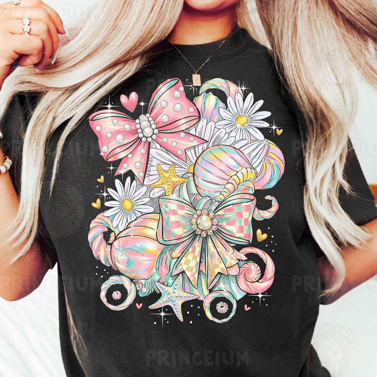 a woman wearing a black t - shirt with a bow and flowers on it