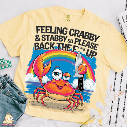 a t - shirt with a crab holding a knife