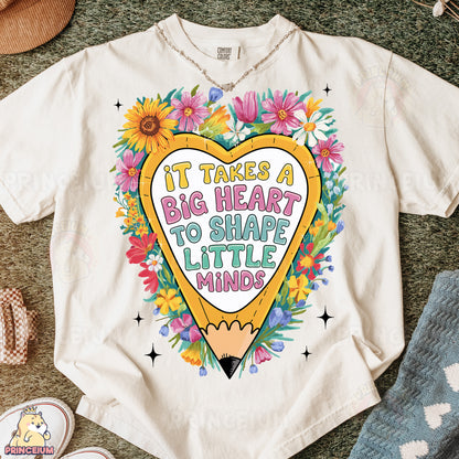 a t - shirt that says it takes a big heart to shape little minds