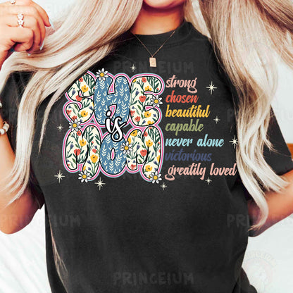 a woman wearing a black t - shirt with a flower design