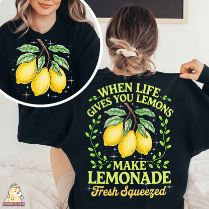 a woman wearing a black shirt with lemons on it