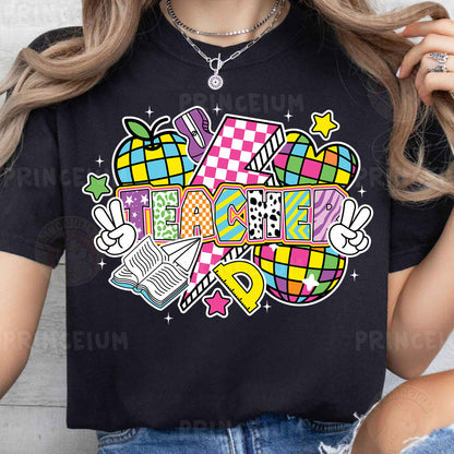 a woman wearing a black t - shirt with a colorful design on it