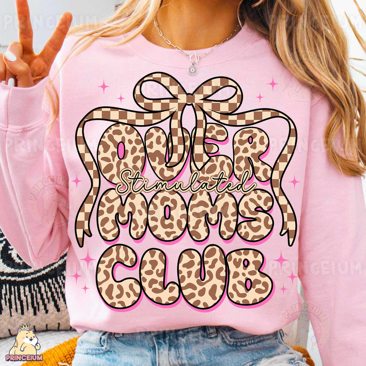 a woman wearing a pink shirt with a leopard print on it