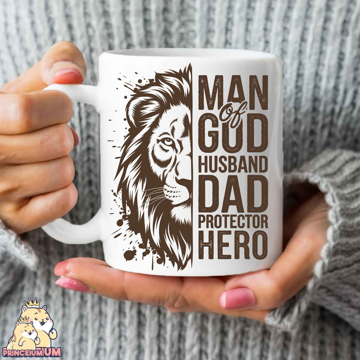 a woman holding a coffee mug with a lion on it