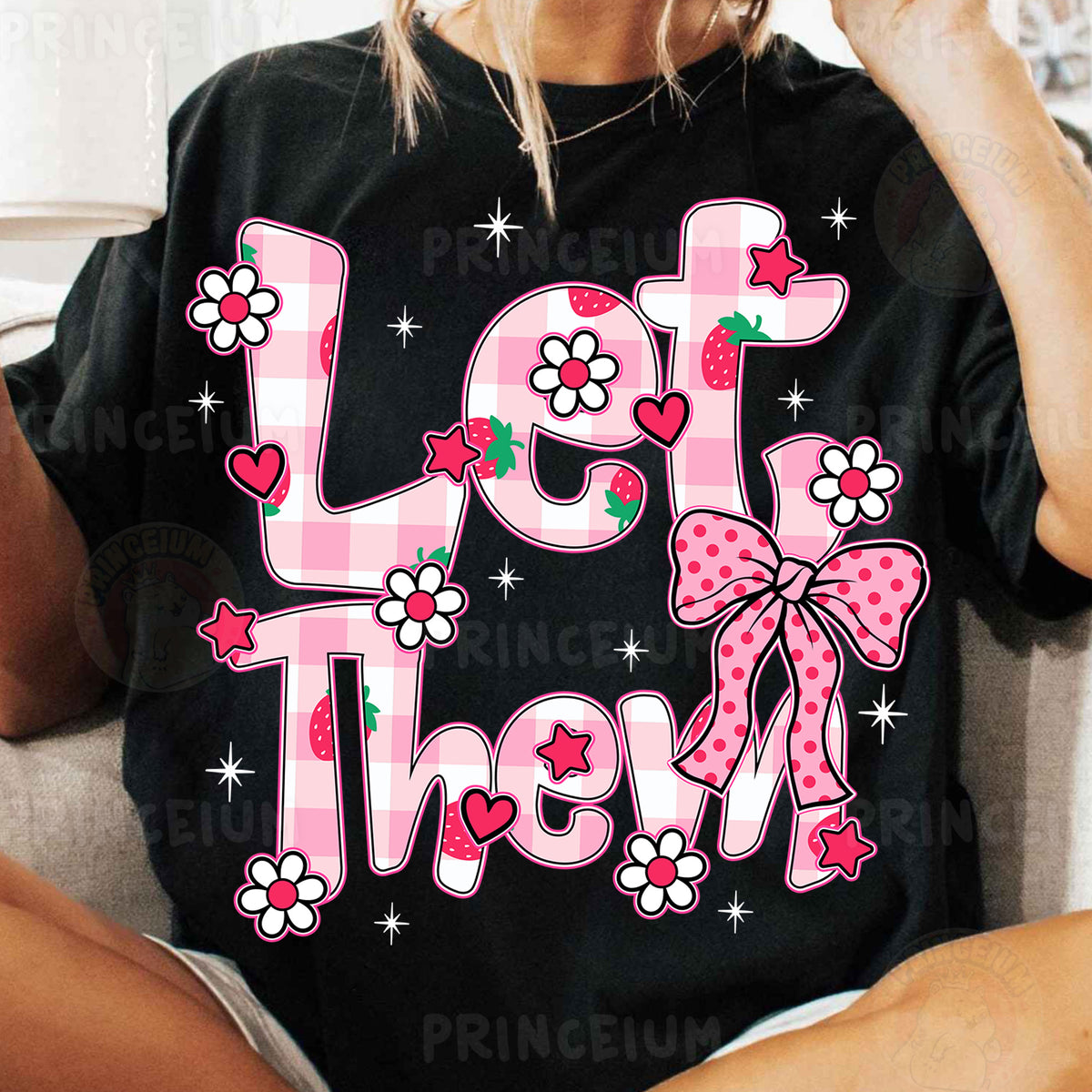 a woman sitting on a couch wearing a t - shirt with the words let them