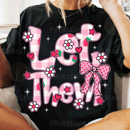 a woman sitting on a couch wearing a t - shirt with the words let them