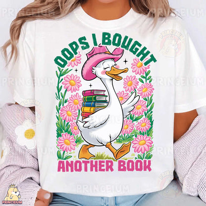 a woman wearing a white t - shirt with a duck reading a book