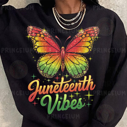 a woman wearing a black sweatshirt with a rainbow butterfly on it
