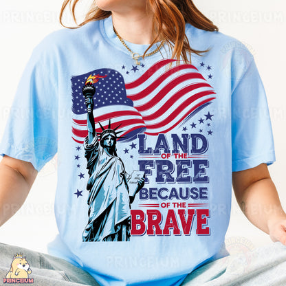a woman wearing a t - shirt with the statue of liberty holding an american flag