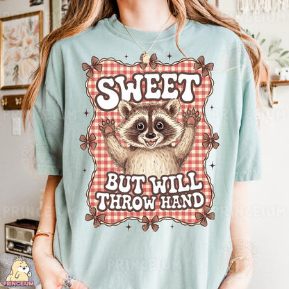 a woman wearing a t - shirt that says sweet but will throw hand