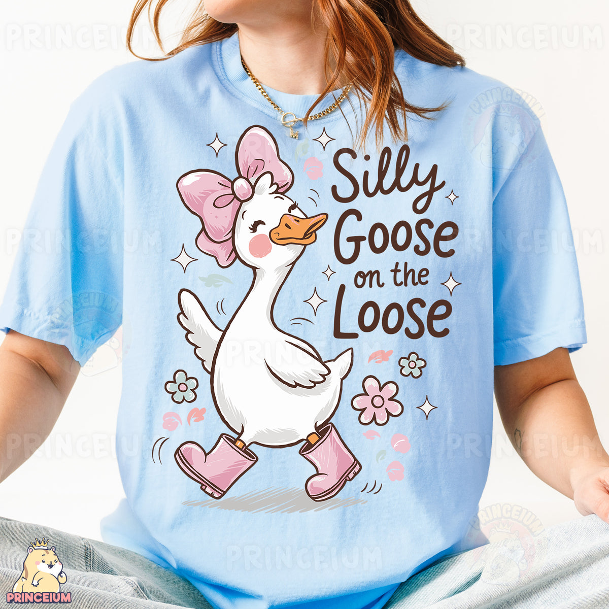 a girl wearing a blue shirt with a duck on it