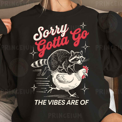 a woman wearing a black sweatshirt with a raccoon on it