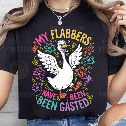 a woman wearing a black shirt with a white swan on it