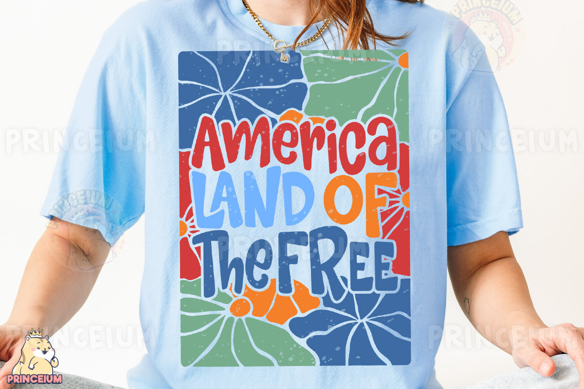 a woman wearing a blue t - shirt with the words america land of the free