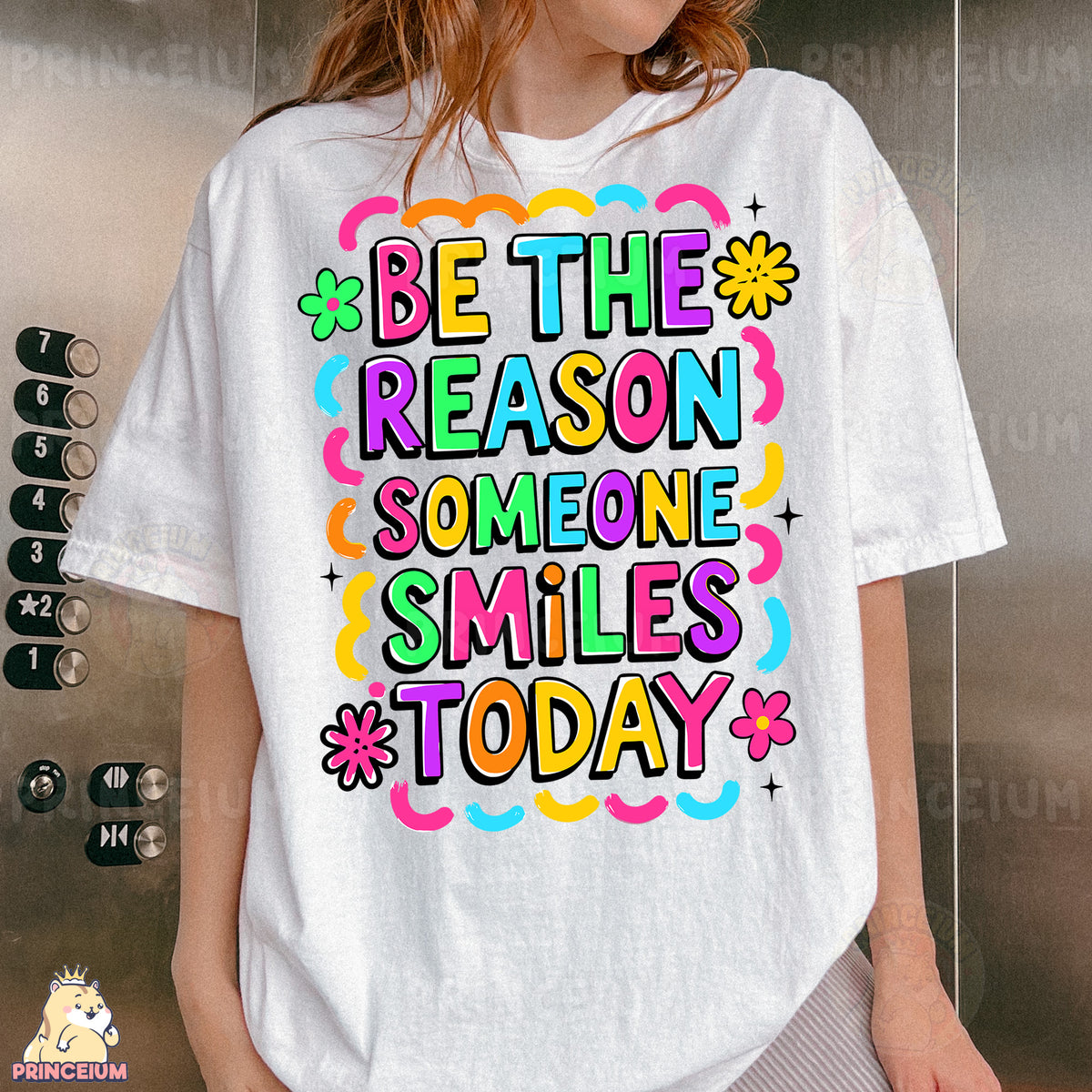 a woman wearing a t - shirt that says be the reason someone smiles today