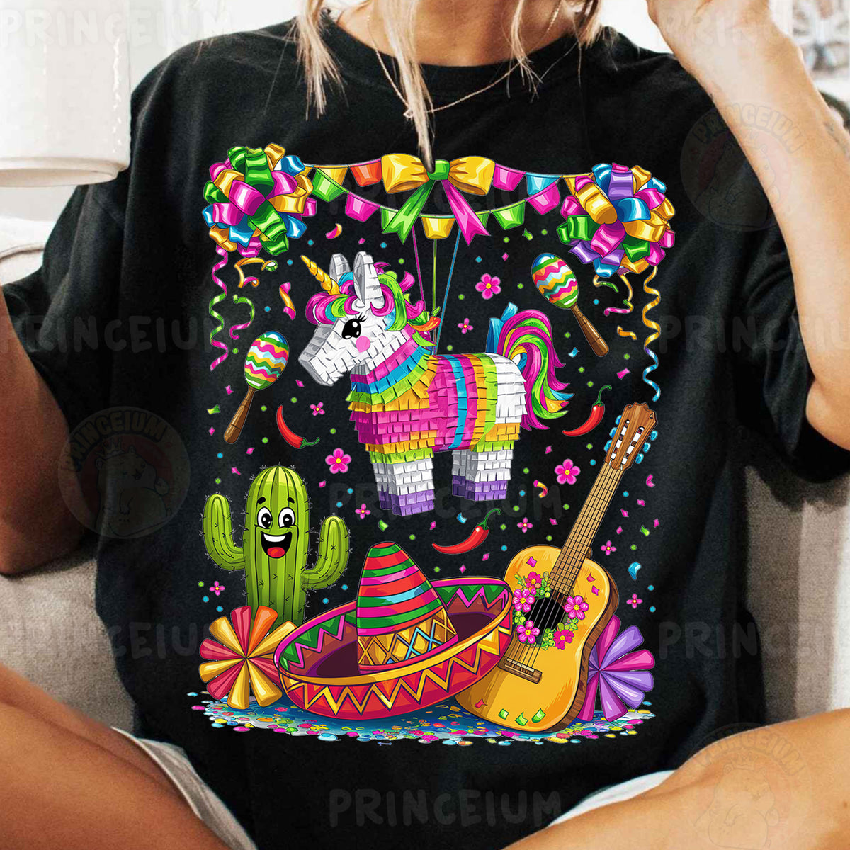 a woman sitting on a couch wearing a black t - shirt with an image of